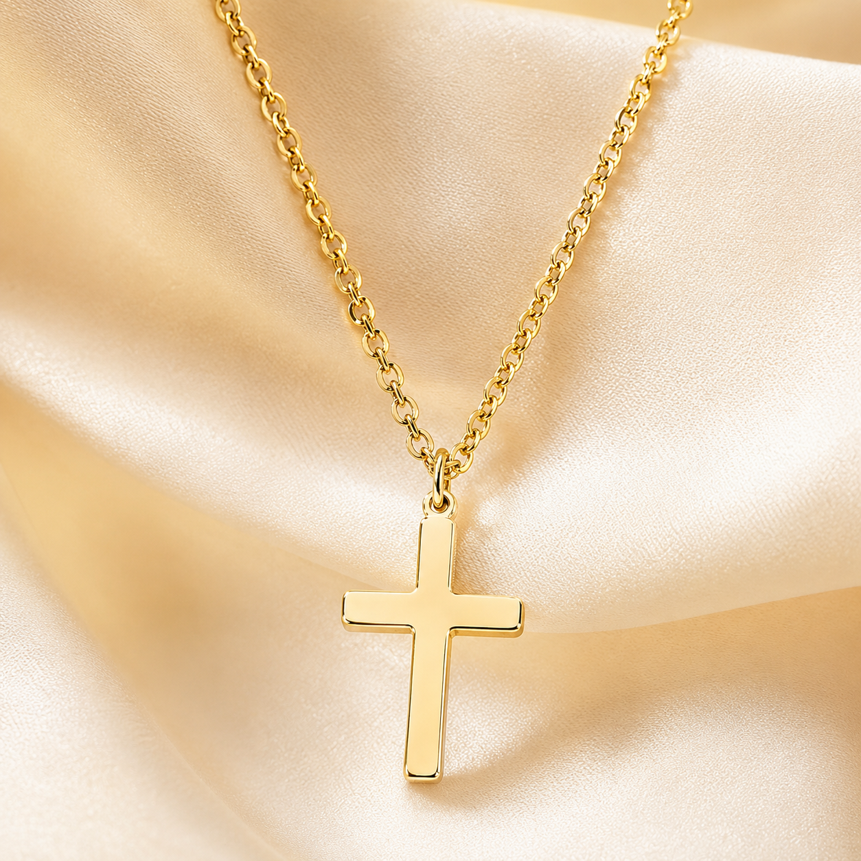 Close-up of gold-tone cross pendant and chain